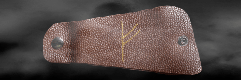 Uğurların amuleti kimi dəri üzərində Fehu rune